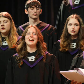 Four students sing during a Purple Aires concert.