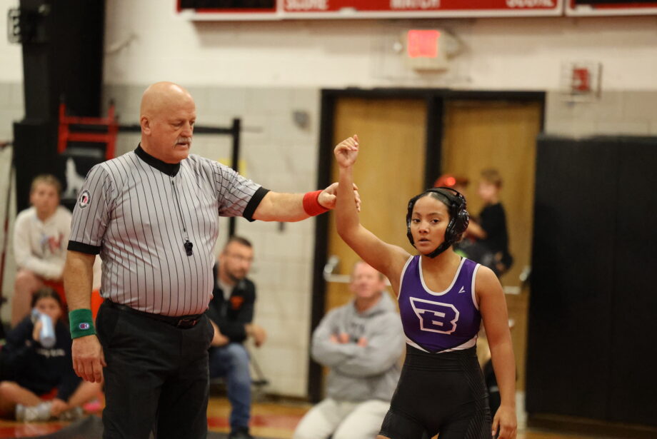 Burlington High School sophomore Sarina Cline, top, and senior Kyra Nash, bottom, win matches Monday, Nov. 27, during Fort Madison High School’s wrestling invitational. They are among 21 members of BHS’s first-ever girls wrestling team.