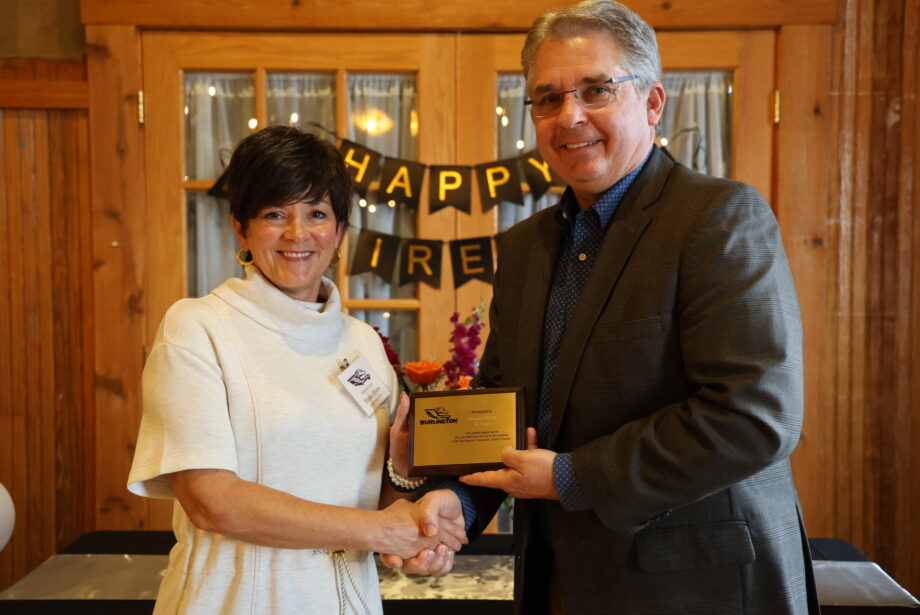 BHS Principal Monica Myers poses for a photo with Superintendent Robert Scott after being presented with a plaque recognizing her more than 30 years in education during a retirement banquet.