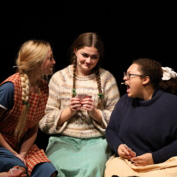 Three student actresses argue as part of a scene for the fall production of 