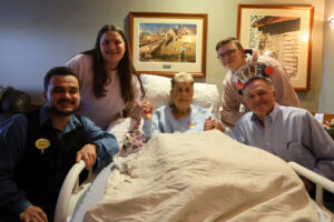 Burlington High School students Traeh Pender and William Woodard pose for a photo alongside Mary Kelly and her husband, Charles Kelly, and BHS graduate and former DreamCatchers member Machias Perez Wednesday, March 20, at Southeast Iowa Regional Hospice House in West Burlington. DreamCatchers, a BHS club that grants wishes for hospice patients, was there to host a Casino Night for Kelly, who passed away Sunday, March 24.