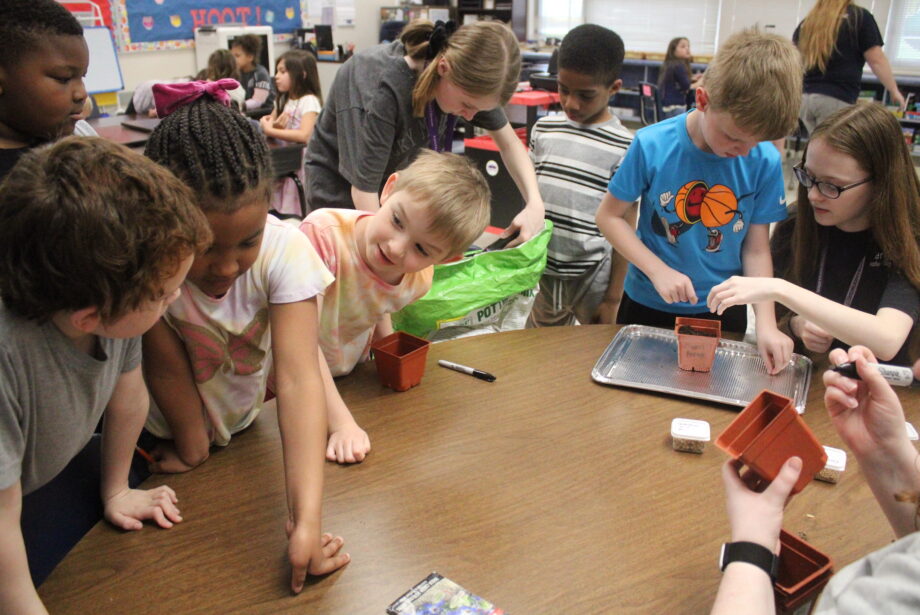 PiECES students plant seeds Wednesday, April 19, 2023, at Sunnyside Elementary School. The activity was brought to them by Brianne Sly, Green Iowa AmeriCorps sustainability coordinator.