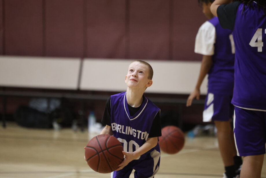 Ayden Tadlock, an eighth-grader at Edward Stone Middle School, warms up Jan. 30, 2024, before a game against Keokuk in the middle school gym.