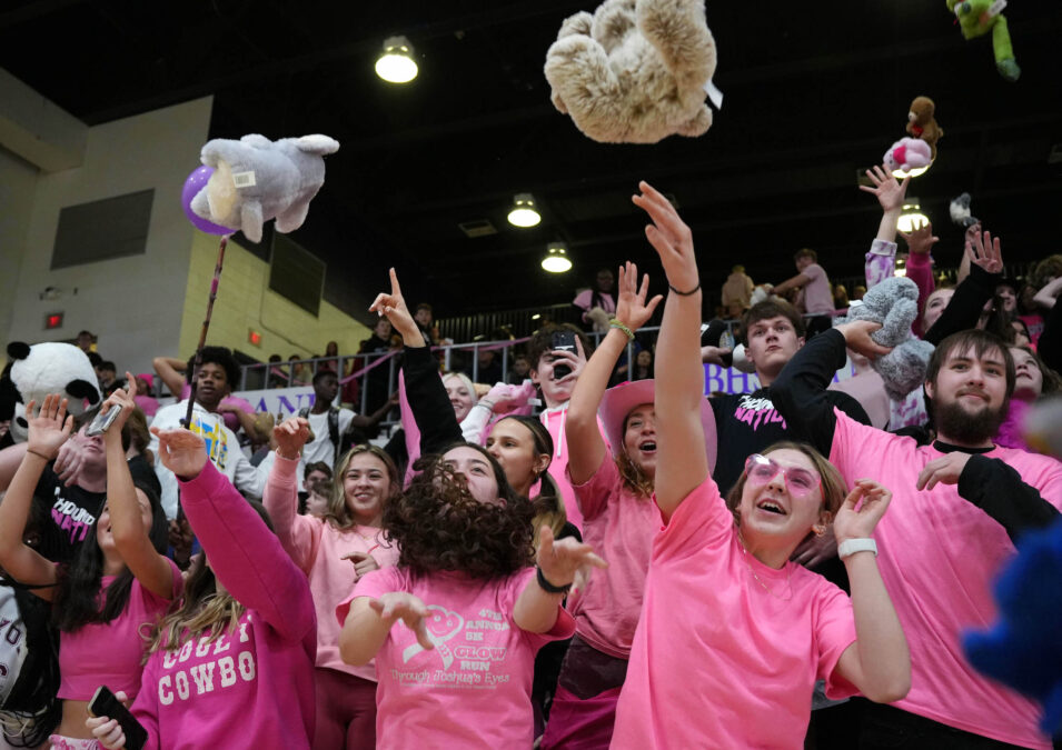 Students throw stuffed animals onto the court Feb. 7, 2023, at Burlington High School's Carl Johannsen Gymnasium during half-time of the boys basketball game against West Burlington for the BHS National Honor Society's Teddy Bear Toss. A total of 209 stuffed animals were donated.