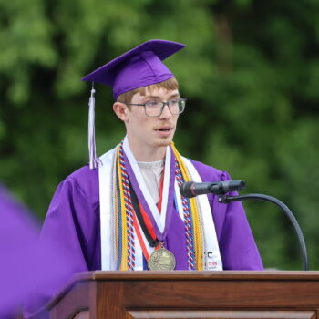 The valedictorian delivers a speech to his classmates during the 2024 commencement ceremony at Bracewell Stadium.