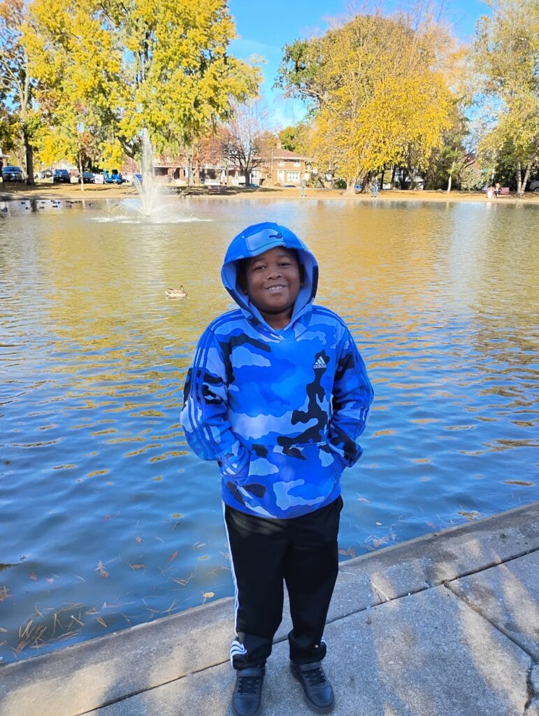 Paul N. Zoway Jr. stands in front of a pond. 