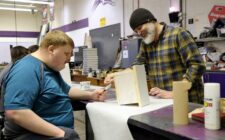 Burlington High School senior Josh Heitmeier and Industrial Technology teacher Aaron Garr paint a birdhouse Friday, Feb. 21, 2025, in the IT classroom at BHS. Heitmeier was among several students enjoying the school’s inaugural Adaptive Industrial Technology class during the second trimester.