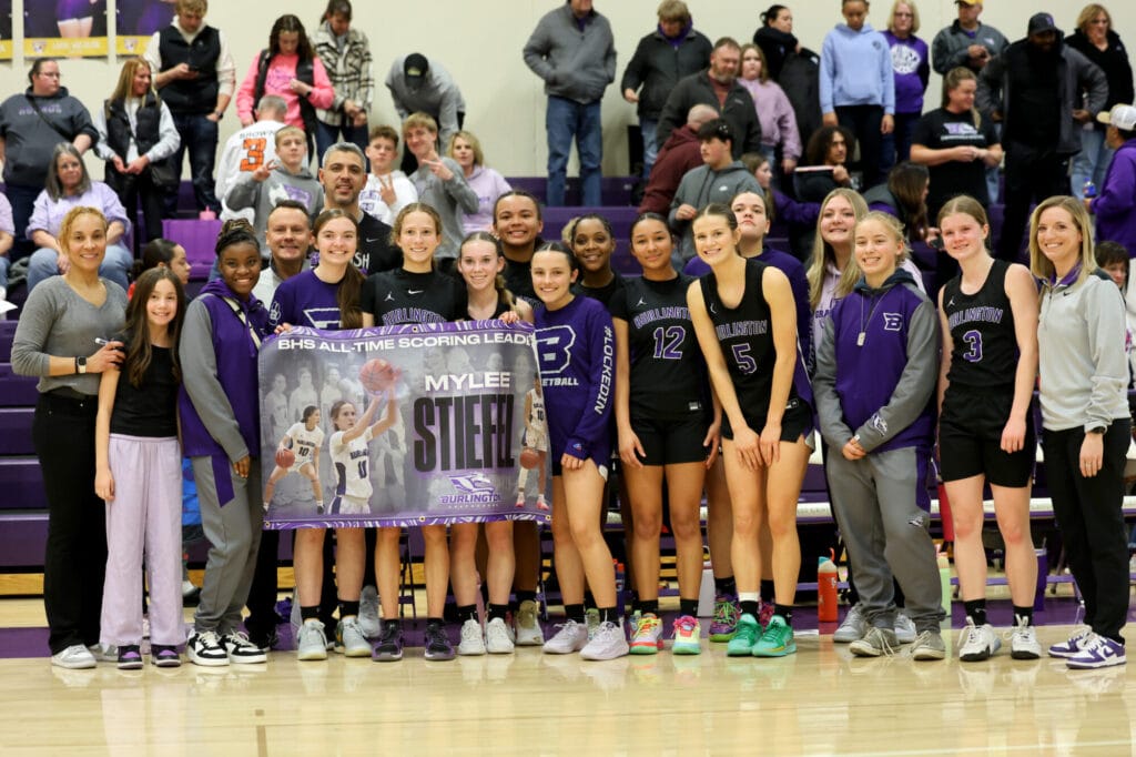 Members of the girls basketball team and their coaches pose for a photo Saturday, Feb. 22, 2025, following their semifinal game against Central DeWitt. The girls ended their season 16-6 overall, with Mylee Steifel making history as BHS's all-time scoring leader.