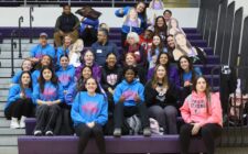 The girls wrestling team and their parents and coaches pose for a photo Feb. 5 ahead of a send-off assembly. Six girls wrestlers qualified for state: Alannah Peterson (5th place), Amaziah Twillie (6th place), Macy Peterson (6th place), Kiara Rodriguez (8th place), Mia Oddo and Grace Navarre.