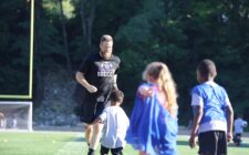 Trevor Cushman is chased by children during a soccer drill June 26, 2024, during Grayhound Soccer Camp at Bracewell Stadium. Trevor, a 2004 graduate of Burlington High School, is carrying on his father’s legacy as the new head coach of the Burlington High School boys soccer team.